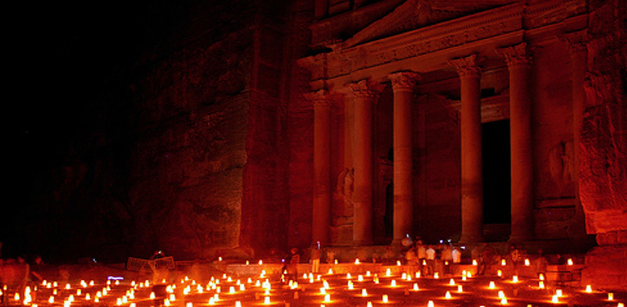 A nighttime candlelight view of the Treasury at Petra